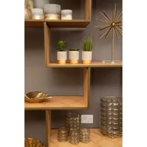 The Marseille Oak and Brass Display Unit combines modern elegance and functionality with its five oak veneer shelves and brushed brass-finished steel frame. This stylish display unit is perfect for showcasing decorative items or storing books, adding a sophisticated, contemporary touch to any living space.