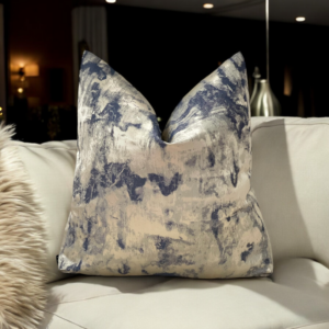 The Orion Navy & Gold Cushion features a stunning combination of deep navy and gold textured fabric, making it a beautiful addition to any cushion set. Its rich colors and unique textures make it a standout individual piece. Available with luxury plump feather inserts or without, the Orion cushion features an invisible zip fastening for a sleek finish, offering both comfort and style to elevate your decor.