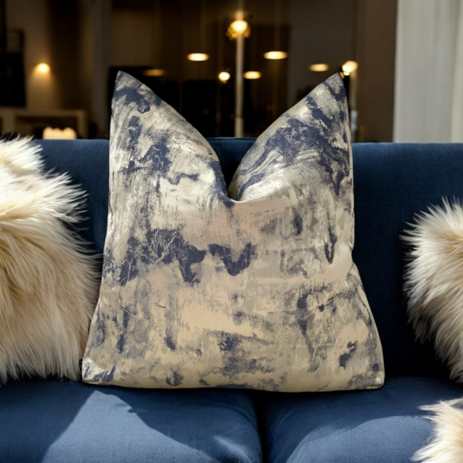 The Orion Navy & Gold Cushion features a stunning combination of deep navy and gold textured fabric, making it a beautiful addition to any cushion set. Its rich colors and unique textures make it a standout individual piece. Available with luxury plump feather inserts or without, the Orion cushion features an invisible zip fastening for a sleek finish, offering both comfort and style to elevate your decor.