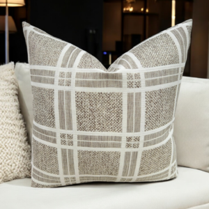 Enhance your home décor with the elegant Beige Plaid Cushion Featuring a sophisticated beige and white plaid pattern, this cushion cover adds a touch of rustic charm and timeless style to any space. The high-quality weaving technique ensures durability and a unique texture that stands out in any room. This stunning brown/taupe textured cushion beautifully complements any room.