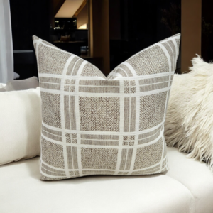 Enhance your home décor with the elegant Beige Plaid Cushion Featuring a sophisticated beige and white plaid pattern, this cushion cover adds a touch of rustic charm and timeless style to any space. The high-quality weaving technique ensures durability and a unique texture that stands out in any room. This stunning brown/taupe textured cushion beautifully complements any room.