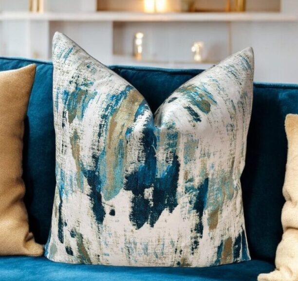 Discover the enchantment of our peacock velvet gold and teal cushion, crafted from a luxurious fabric that boasts a semi-plain texture and complements any décor with its tonal hues. This elegant cushion enhances any upholstered area in your home with its timeless appeal.