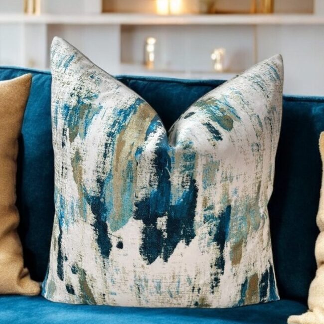 Discover the enchantment of our peacock velvet gold and teal cushion, crafted from a luxurious fabric that boasts a semi-plain texture and complements any décor with its tonal hues. This elegant cushion enhances any upholstered area in your home with its timeless appeal.