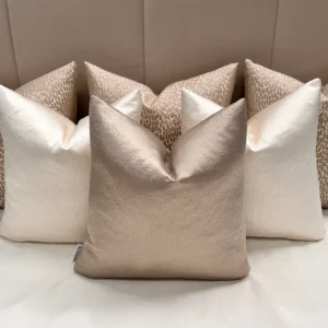 Add elegance to your home with the Luxury Champagne Cushion Set. Includes bespoke handmade cushions in champagne, ivory, and putty. Optional 100% feather inserts available. Perfect for a luxurious 2024 upgrade.