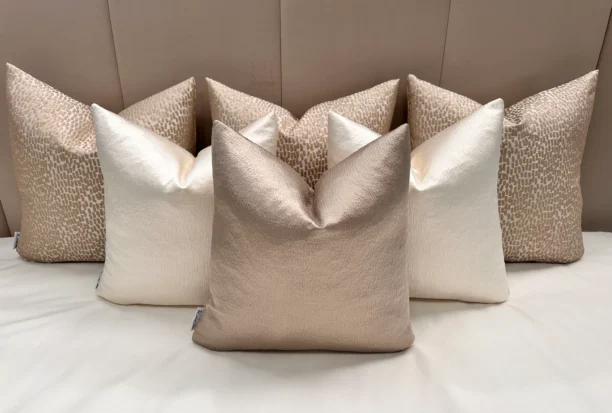 Add elegance to your home with the Luxury Champagne Cushion Set. Includes bespoke handmade cushions in champagne, ivory, and putty. Optional 100% feather inserts available. Perfect for a luxurious 2024 upgrade.