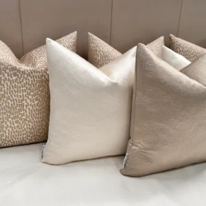 Add elegance to your home with the Luxury Champagne Cushion Set. Includes bespoke handmade cushions in champagne, ivory, and putty. Optional 100% feather inserts available. Perfect for a luxurious 2024 upgrade.