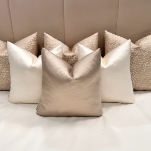 Add elegance to your home with the Luxury Champagne Cushion Set. Includes bespoke handmade cushions in champagne, ivory, and putty. Optional 100% feather inserts available. Perfect for a luxurious 2024 upgrade.