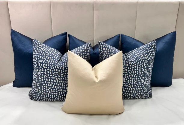 Elevate your home with the Navy and Gold Luxe Cushion Set. Bespoke handmade luxury cushions with navy and gold tones, available with feather inserts.