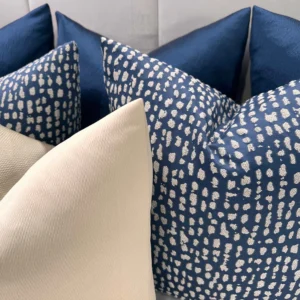 Elevate your home with the Navy and Gold Luxe Cushion Set. Bespoke handmade luxury cushions with navy and gold tones, available with feather inserts.