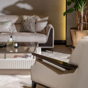 Sensatori Luxury Sofa with dark wood accents and plush beige upholstery, featuring bespoke design options in a variety of fabrics and finishes.