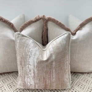 Elevate your space with the Luxury Bohemian Bouclé Cushion Set. Handmade bespoke cushions in taupe and ivory, featuring bouclé textures and fringe detailing.