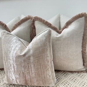 Elevate your space with the Luxury Bohemian Bouclé Cushion Set. Handmade bespoke cushions in taupe and ivory, featuring bouclé textures and fringe detailing.