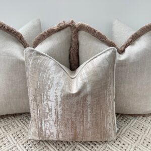 Elevate your space with the Luxury Bohemian Bouclé Cushion Set. Handmade bespoke cushions in taupe and ivory, featuring bouclé textures and fringe detailing.