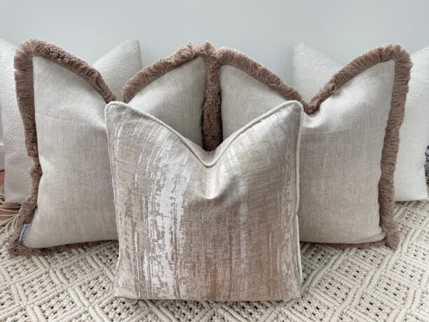 Elevate your space with the Luxury Bohemian Bouclé Cushion Set. Handmade bespoke cushions in taupe and ivory, featuring bouclé textures and fringe detailing.