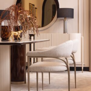 Bellina dining table with cream gloss finish and curved design, paired with bespoke boucle fabric chairs