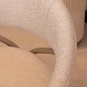 Bellina dining table with cream gloss finish and curved design, paired with bespoke boucle fabric chairs