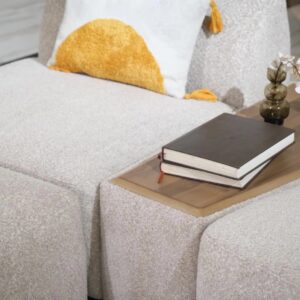 Amalfi corner chaise sofa in a luxurious neutral fabric with optional built-in wooden table, accented with plush cushions and modern Italian-inspired design, set in a contemporary living room