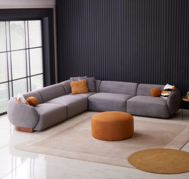 Amalfi corner chaise sofa in a luxurious neutral fabric with optional built-in wooden table, accented with plush cushions and modern Italian-inspired design, set in a contemporary living room