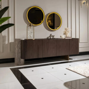 Palermo sideboard with dark wood veneer, travertine stone pillar, and brushed gold base; paired with a round led mirror.