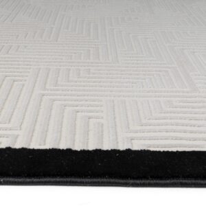 Full view of the Labyrinth Border Rug with a modern geometric design and bold black border.