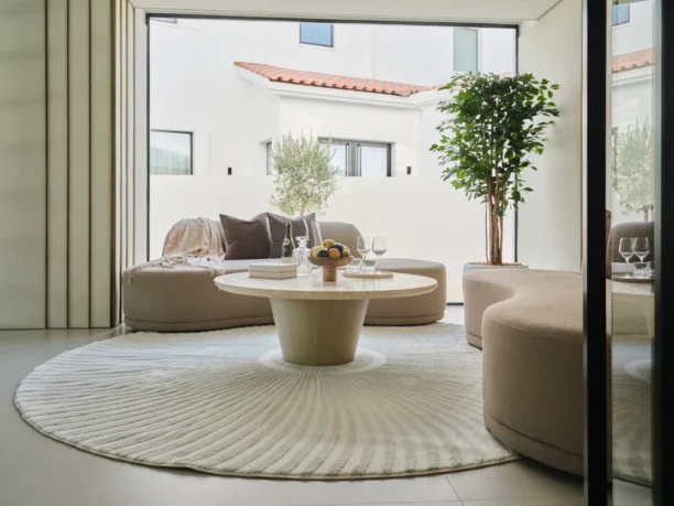 Round rug with a modern Solstice design, featuring soft polypropylene and shrink polyester material, in neutral tones with a 20mm pile height. Perfect for contemporary living spaces.