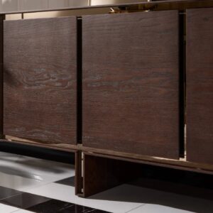 Front view of the Dakota Sideboard with dark wood veneer finish and brushed gold trims, styled with elegant décor.