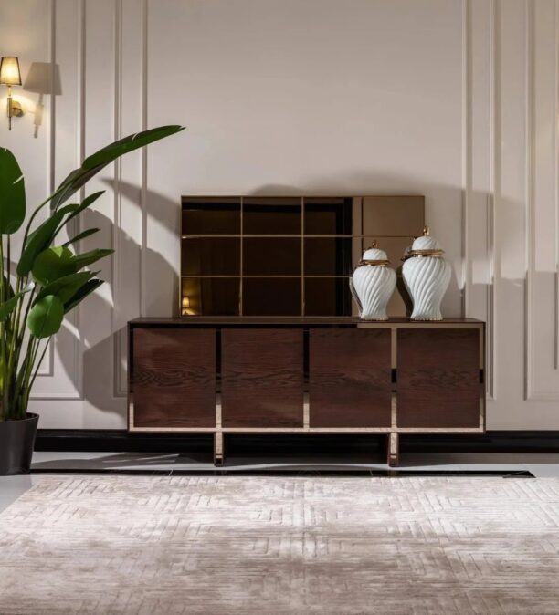 Front view of the Dakota Sideboard with dark wood veneer finish and brushed gold trims, styled with elegant décor.