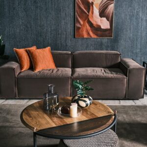 Elegant Sierra Sofa in a light fabric finish, accented with rust-colored scatter cushions, displayed in a contemporary living room.