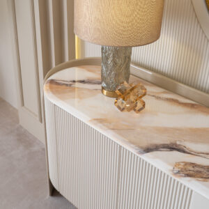 Elegant Tropez Sideboard in a luxury interior with marble top and gold accents.