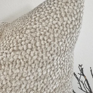 The Oatmeal Bouclé Cushion brings a touch of understated luxury with its plush velvet-bouclé texture and warm neutral tone. Its rich fabric adds depth and warmth, making it a perfect accent for any interior.