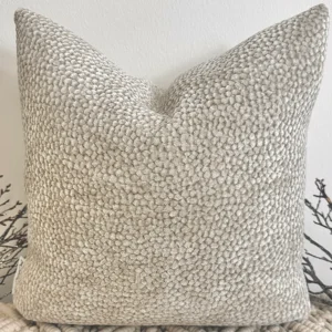 The Oatmeal Bouclé Cushion brings a touch of understated luxury with its plush velvet-bouclé texture and warm neutral tone. Its rich fabric adds depth and warmth, making it a perfect accent for any interior.