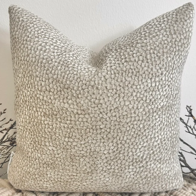 The Oatmeal Bouclé Cushion brings a touch of understated luxury with its plush velvet-bouclé texture and warm neutral tone. Its rich fabric adds depth and warmth, making it a perfect accent for any interior.