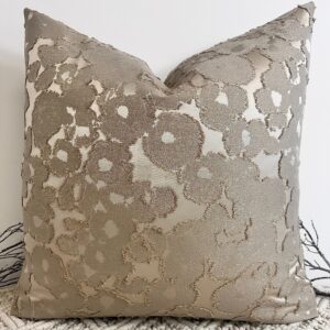 The Aurora Textured Taupe Cushion blends timeless elegance with modern texture. Featuring a rich taupe base with shimmering gold flecks woven throughout, it adds depth and sophistication to any space. The intricate fabric design creates a beautiful contrast of matte and sheen, making it a true statement piece. This luxurious cushion is available in various sizes and can be made to order with your choice of 100% duck feather or polyester inserts. Designed with an invisible zip fastening for a seamless finish, it’s perfect for layering on sofas, beds, or accent chairs.