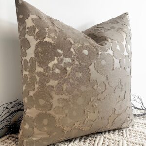 The Aurora Textured Taupe Cushion blends timeless elegance with modern texture. Featuring a rich taupe base with shimmering gold flecks woven throughout, it adds depth and sophistication to any space. The intricate fabric design creates a beautiful contrast of matte and sheen, making it a true statement piece. This luxurious cushion is available in various sizes and can be made to order with your choice of 100% duck feather or polyester inserts. Designed with an invisible zip fastening for a seamless finish, it’s perfect for layering on sofas, beds, or accent chairs.