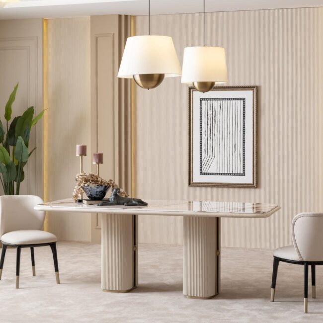 Valentina Dining Chair with curved back, black legs, and gold-tipped feet—refined elegance with bespoke fabric options.